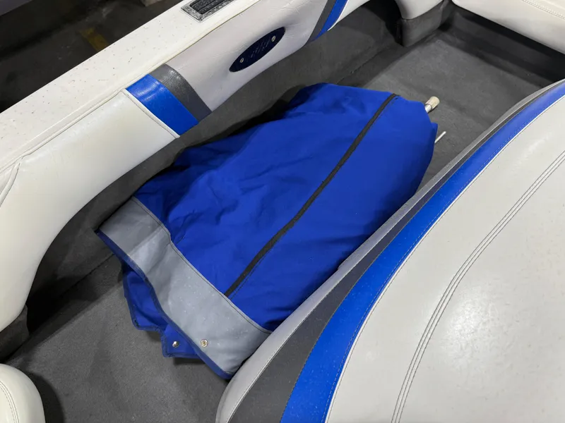 Slide: The Image of 2002 Malibu Response LX interior with blue and gray upholstery and a blue bag on the floor. - 10