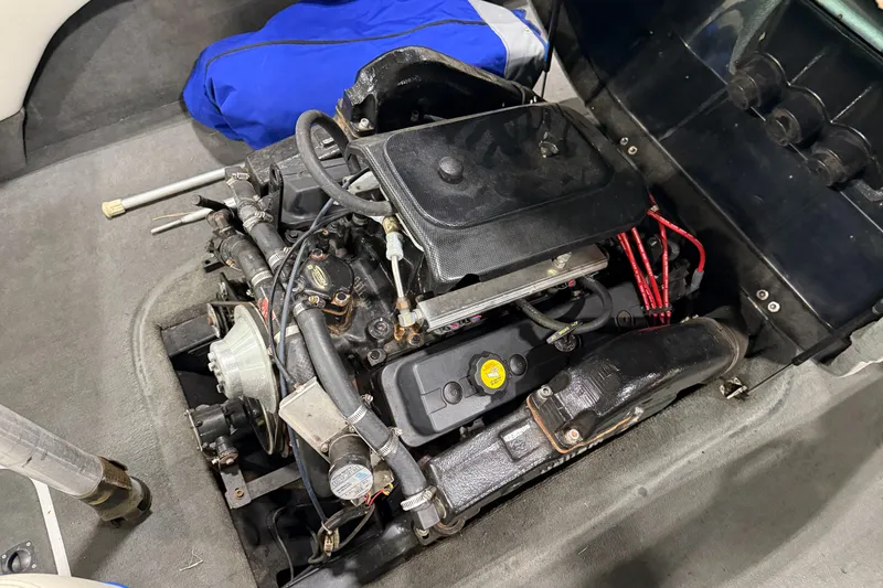 Slide: The Image of 2002 Malibu Response LX engine compartment with visible components and wiring. - 8