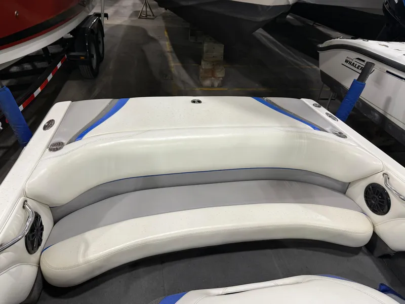 Slide: The Image of 2002 Malibu Response LX boat interior with white and blue seating. - 9