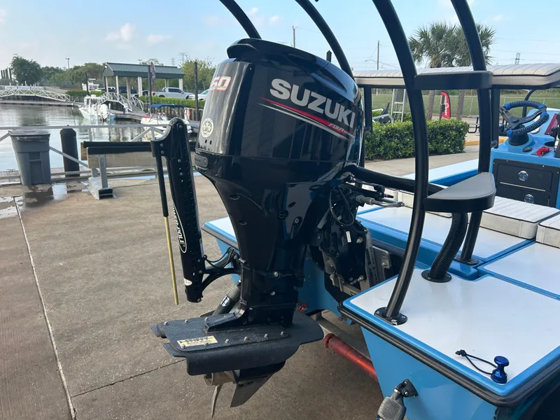 Slide: The Image of 2019 East Cape Fury boat with Suzuki outboard motor docked at marina. - 11