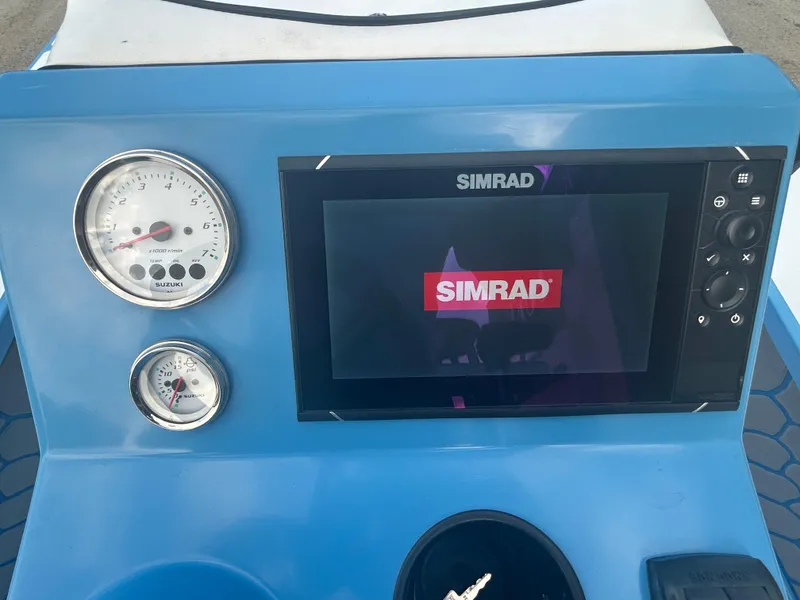 Slide: The Image of 2019 East Cape Fury dashboard with Simrad display and gauges. - 12