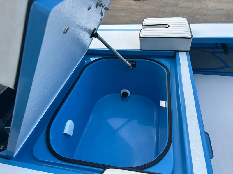 Slide: The Image of 2019 East Cape Fury boat with open blue storage compartment. - 18