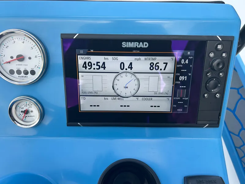 Slide: The Image of Dashboard of a 2019 East Cape Fury boat with Simrad display and gauges. - 21