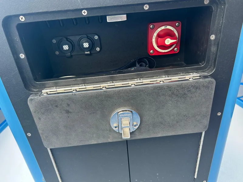 Slide: The Image of 2019 East Cape Fury boat compartment with control switches and a red power knob. - 24
