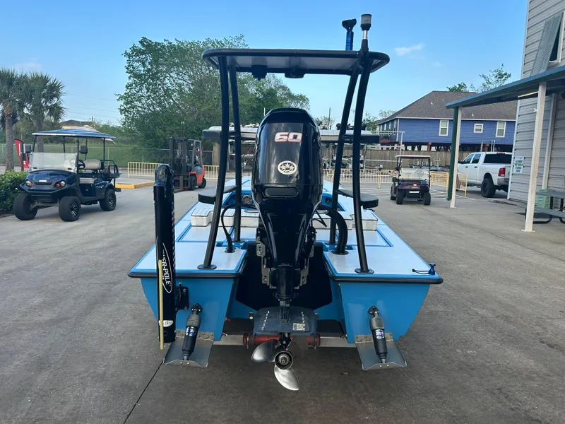 Slide: The Image of 2019 East Cape Fury boat with outboard motor, parked on concrete driveway. - 5