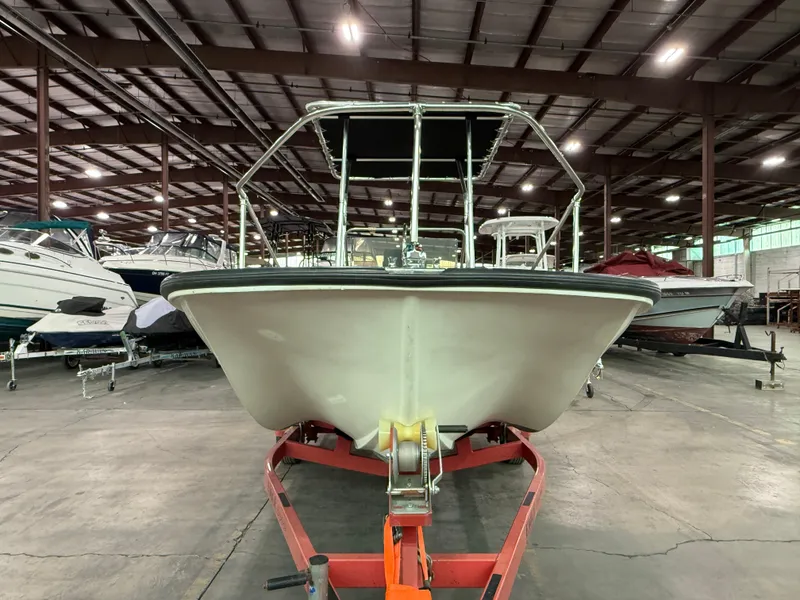 Slide: The Image of 1974 Boston Whaler 17 Montauk boat on trailer in indoor storage facility. - 3