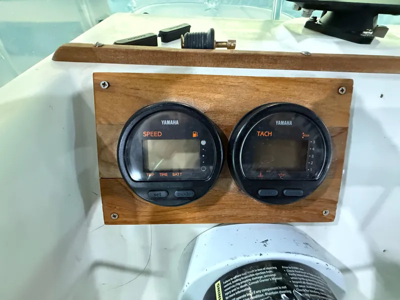 Slide: The Image of Yamaha speed and tach gauges on 1974 Boston Whaler 17 Montauk dashboard. - 7