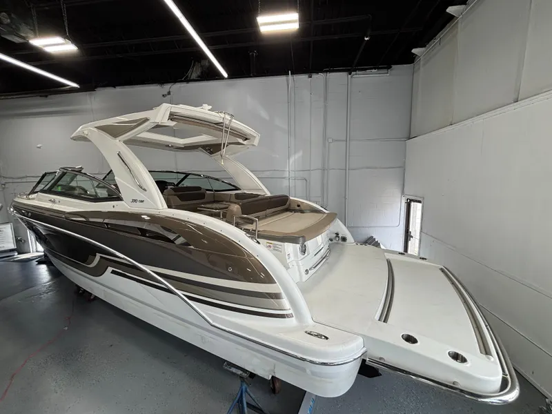 The Image of 2019 Formula 350 Crossover Bowrider I/O in showroom, sleek design, luxury features. - 0