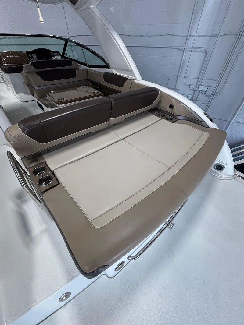 Slide: The Image of 2019 Formula 350 Crossover Bowrider I/O interior with luxurious seating and sleek design. - 2