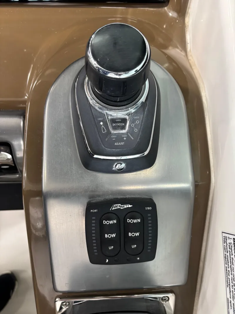 Slide: The Image of 2019 Formula 350 Crossover Bowrider I/O control panel with joystick and trim buttons. - 24