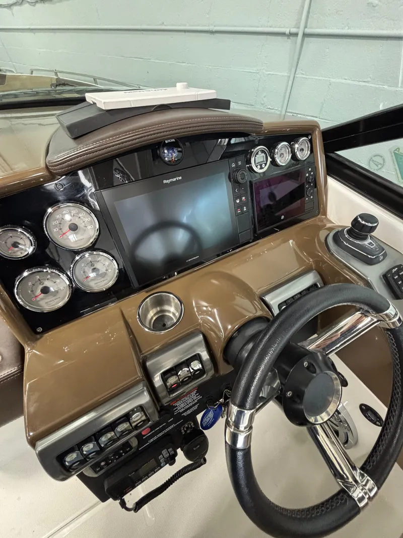 Slide: The Image of 2019 Formula 350 Crossover Bowrider I/O dashboard with gauges and steering wheel. - 25