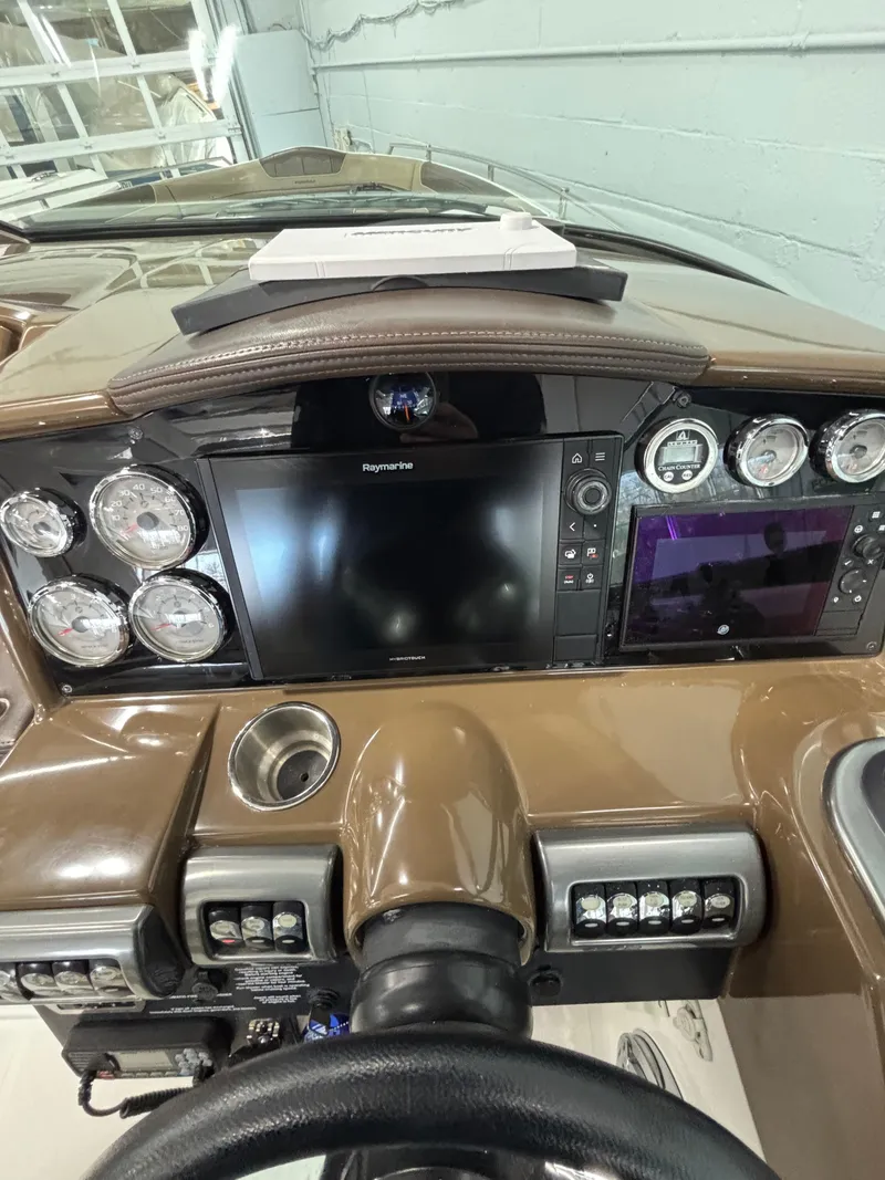 Slide: The Image of 2019 Formula 350 Crossover Bowrider I/O dashboard with gauges and navigation screen. - 27