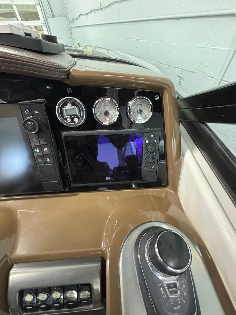 Slide: The Image of Dashboard of a 2019 Formula 350 Crossover Bowrider I/O with gauges and controls. - 28