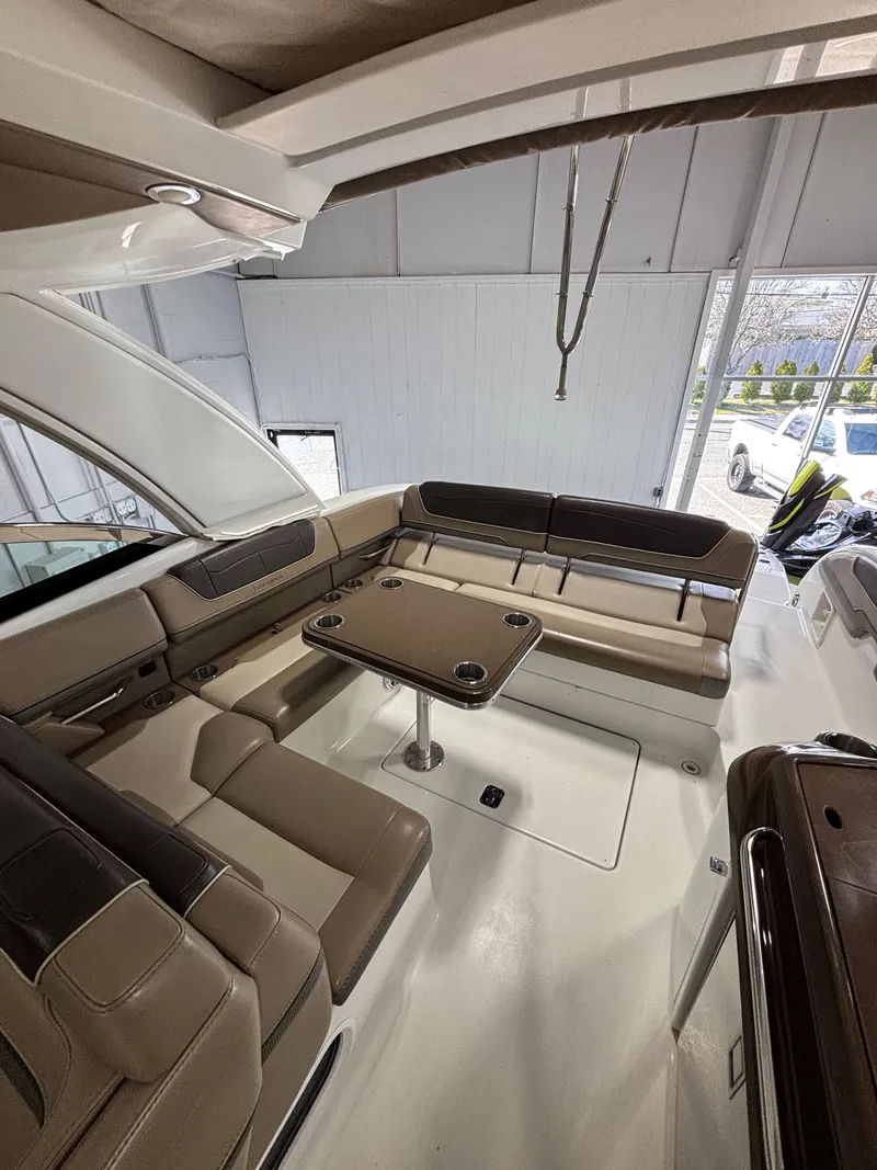 Slide: The Image of 2019 Formula 350 Crossover Bowrider I/O interior with seating and table. - 3