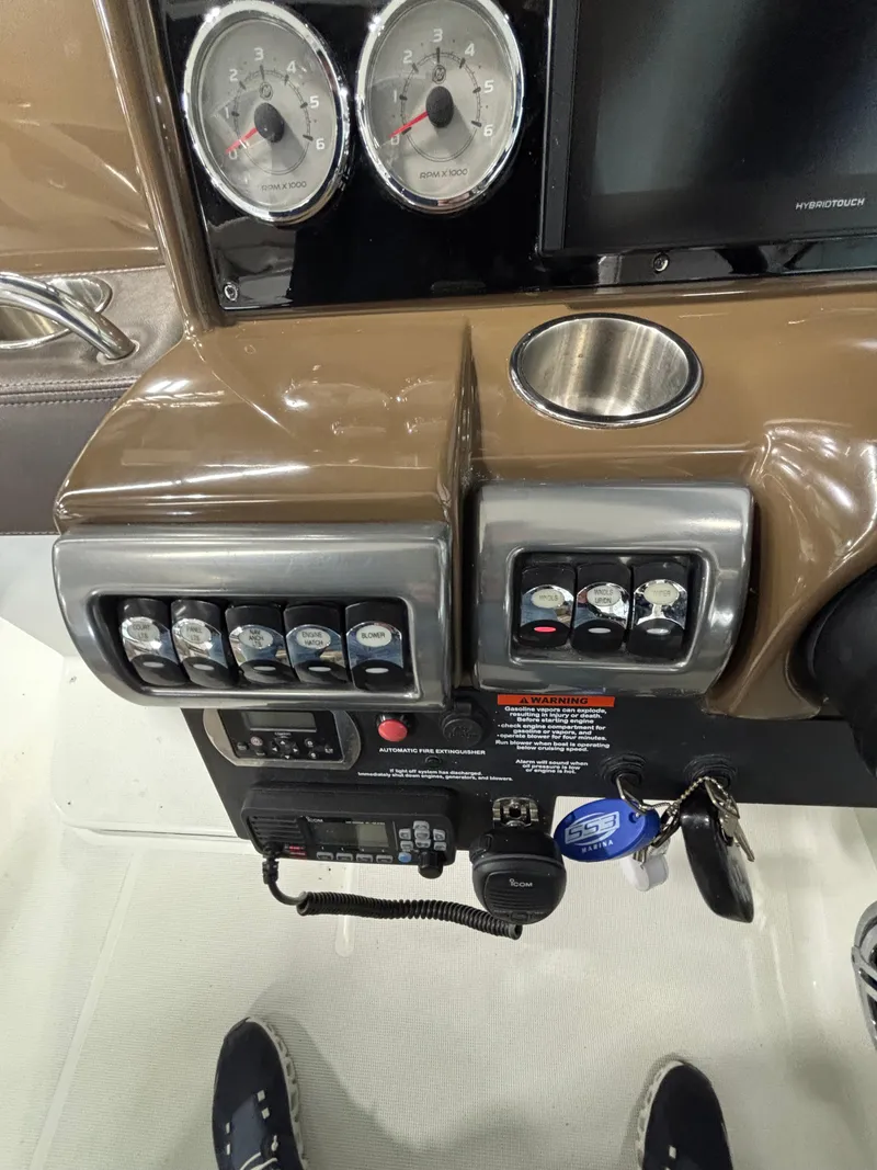 Slide: The Image of 2019 Formula 350 Crossover Bowrider I/O dashboard with gauges and controls. - 30