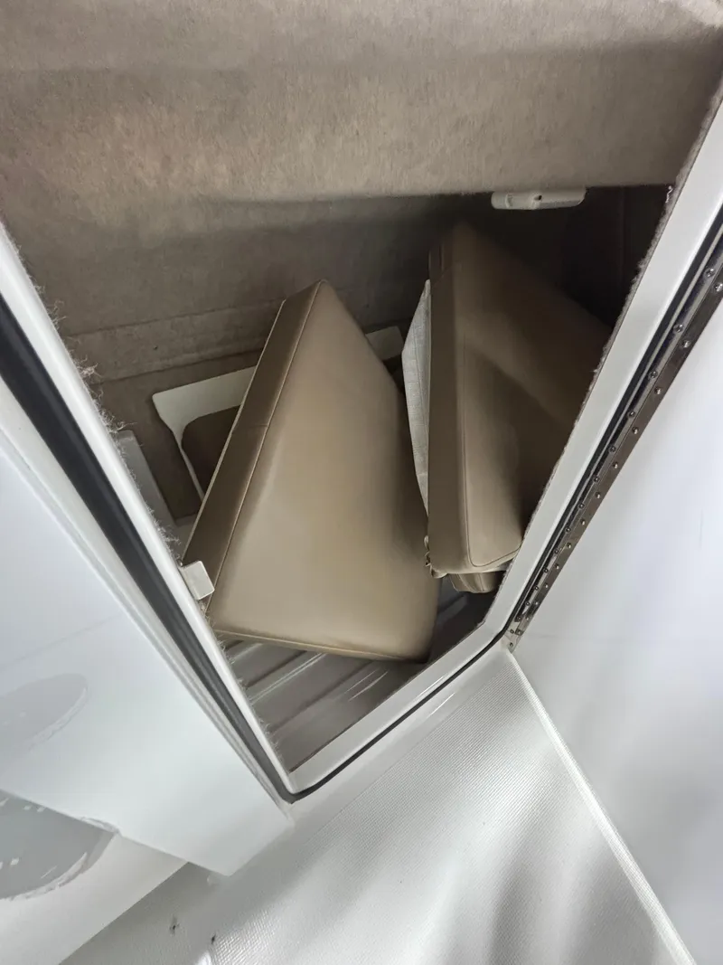 Slide: The Image of 2019 Formula 350 Crossover Bowrider I/O interior storage compartment with cushions. - 32