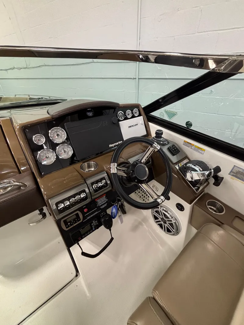 Slide: The Image of 2019 Formula 350 Crossover Bowrider I/O dashboard with steering wheel and gauges. - 6