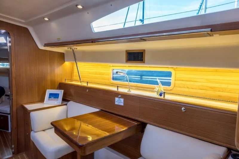 Slide: The Image of Interior of 2026 Catalina 426 yacht with elegant wood finish and cozy seating area. - 2