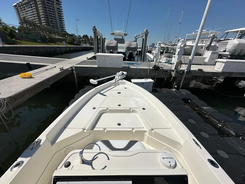 Slide: The Image of 2021 Skeeter SX 2250 boat docked at marina with clear blue sky. - 7