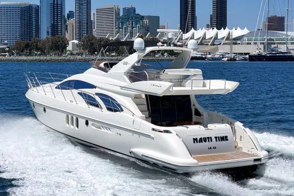 Slide: The Image of Luxurious 2007 Azimut 62 yacht cruising near city skyline. - 10
