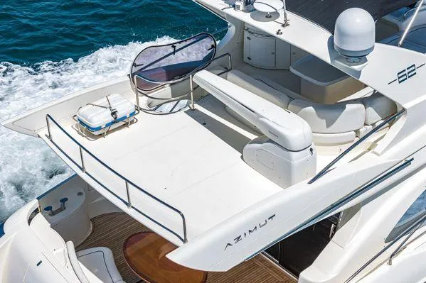 Slide: The Image of 2007 Azimut 62 yacht with spacious deck cruising on open water. - 13