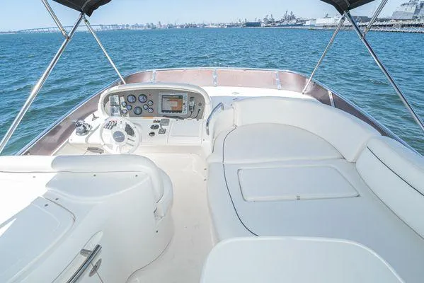 Slide: The Image of 2007 Azimut 62 yacht helm with ocean view, featuring modern controls and seating. - 15