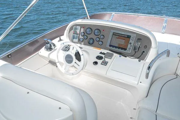 Slide: The Image of Helm of 2007 Azimut 62 yacht with navigation instruments and steering wheel. - 17