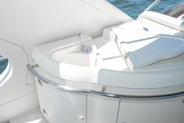 Slide: The Image of Luxurious 2007 Azimut 62 yacht interior with sleek white sink and modern design. - 18