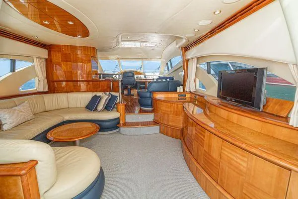 Slide: The Image of Luxurious interior of a 2007 Azimut 62 yacht with elegant wood finishes and plush seating. - 27