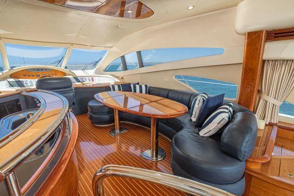 Slide: The Image of Luxurious interior of a 2007 Azimut 62 yacht with elegant seating and ocean view. - 29