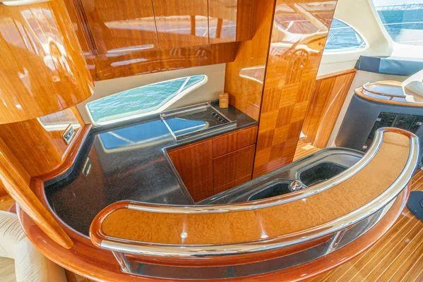 Slide: The Image of Luxurious interior of a 2007 Azimut 62 yacht with sleek wood finishes and modern design. - 34