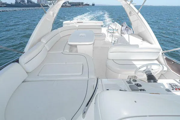 Slide: The Image of Luxurious 2007 Azimut 62 yacht with spacious white deck cruising on open water. - 4