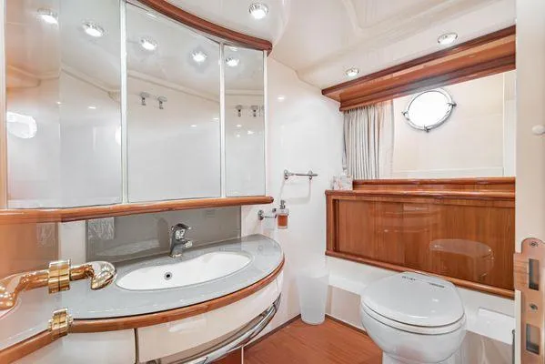 Slide: The Image of Luxurious bathroom in 2007 Azimut 62 yacht with elegant wood accents and modern fixtures. - 40