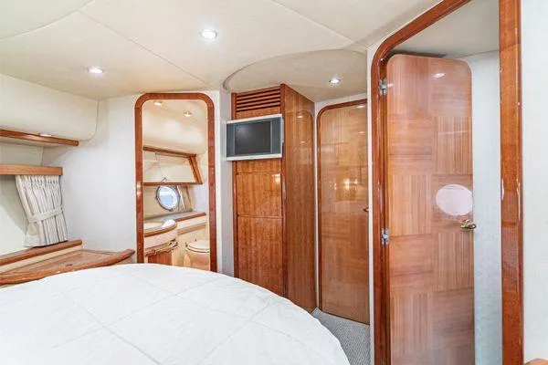 Slide: The Image of Luxurious interior of a 2007 Azimut 62 yacht with wood finishes and modern amenities. - 46
