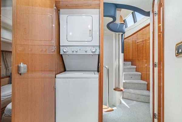 Slide: The Image of 2007 Azimut 62 yacht interior with washer-dryer and elegant staircase. - 49