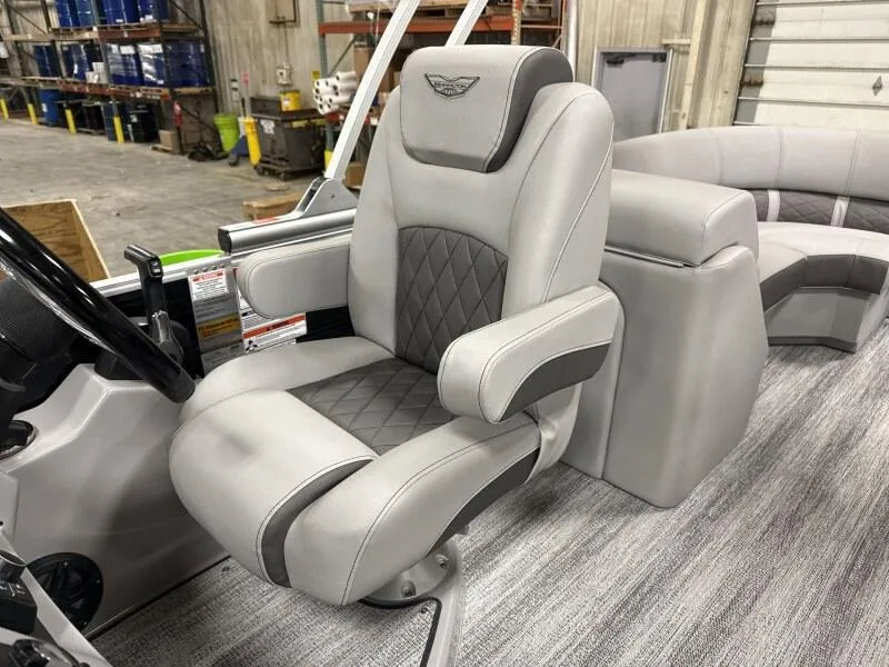 Slide: The Image of 2025 Bennington 23LFB boat interior with luxurious captain's chair and modern design. - 11
