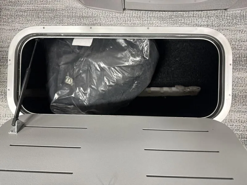 Slide: The Image of Open storage compartment in a 2025 Bennington 23LFB boat. - 7