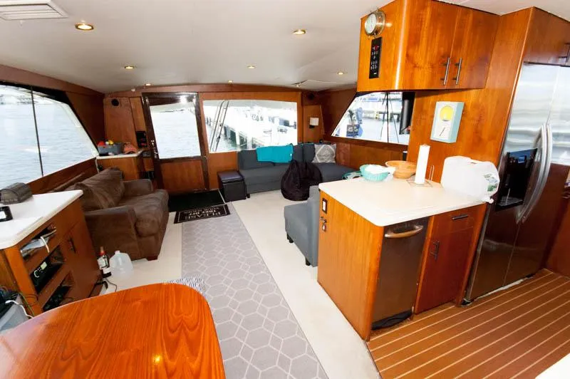 Slide: The Image of Luxurious interior of 1991 Ocean Yachts 58 Super Sport with modern amenities and wood finishes. - 11
