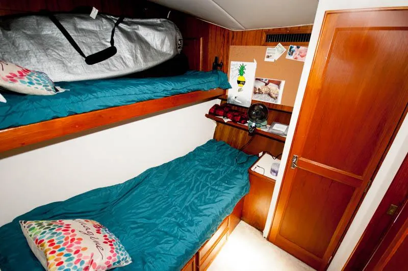 Slide: The Image of Cozy cabin interior of 1991 Ocean Yachts 58 Super Sport with bunk beds and wooden decor. - 18