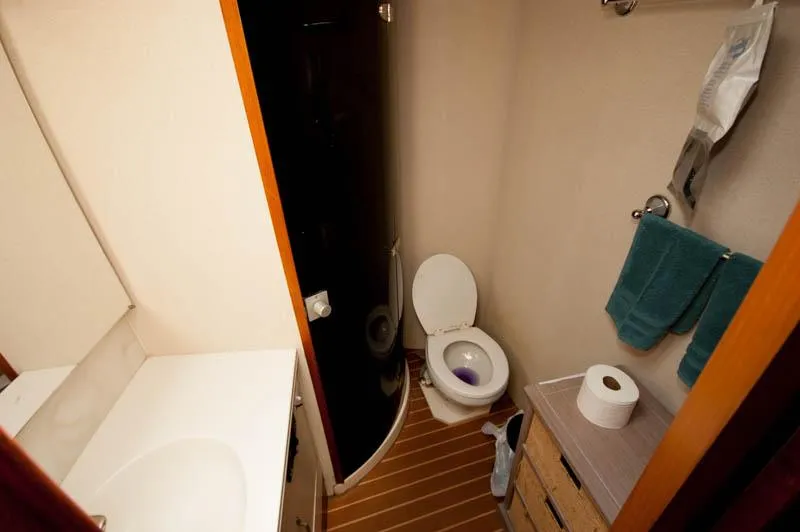 Slide: The Image of Bathroom interior of 1991 Ocean Yachts 58 Super Sport with toilet and sink. - 19