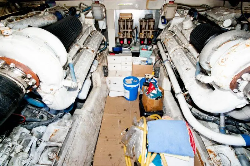 Slide: The Image of Engine room of 1991 Ocean Yachts 58 Super Sport with dual engines and equipment. - 26