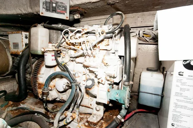 Slide: The Image of Engine room of 1991 Ocean Yachts 58 Super Sport, showing mechanical components and wiring. - 31