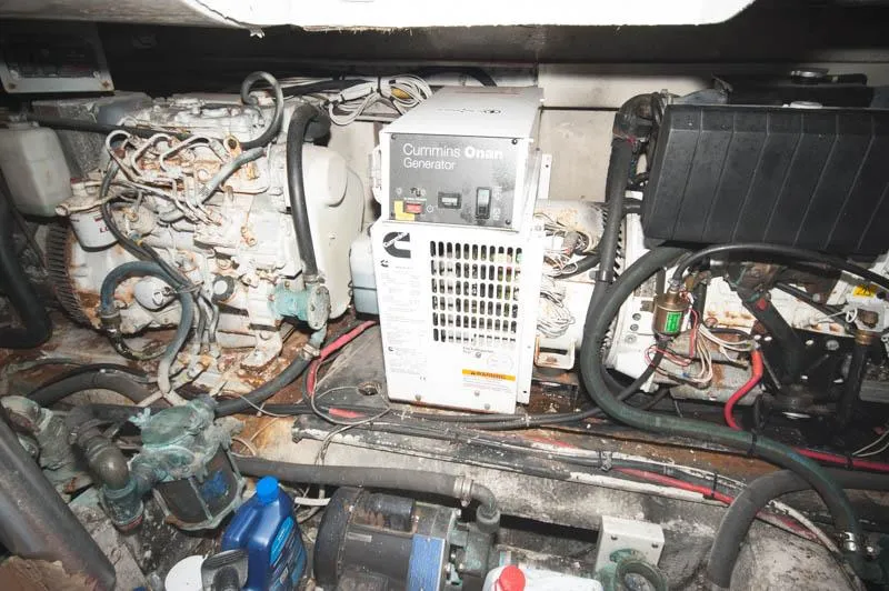 Slide: The Image of Engine room of 1991 Ocean Yachts 58 Super Sport with Cummins Onan generator. - 33