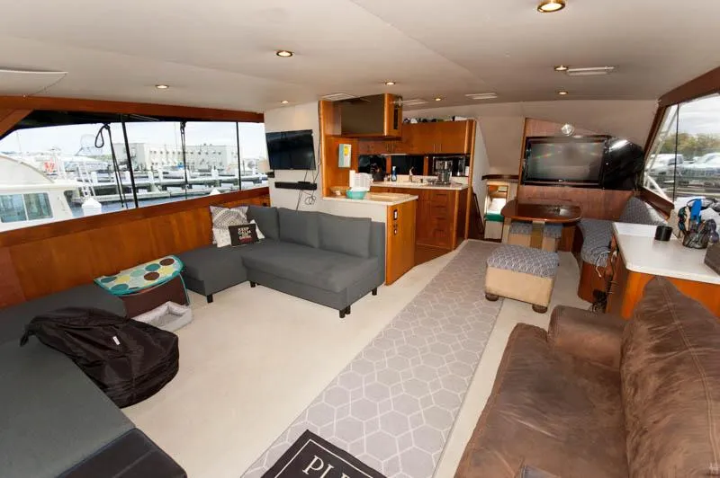 Slide: The Image of Luxurious interior of 1991 Ocean Yachts 58 Super Sport with modern furnishings and ample seating. - 5