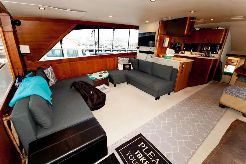 Slide: The Image of Luxurious interior of 1991 Ocean Yachts 58 Super Sport with modern seating and kitchen area. - 9