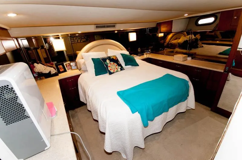 Slide: The Image of Luxurious bedroom in 1991 Ocean Yachts 58 Super Sport with elegant decor and cozy bedding. - 13