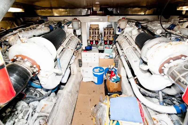 Slide: The Image of Engine room of 1991 Ocean Yachts 58 Super Sport, featuring dual engines and equipment. - 27
