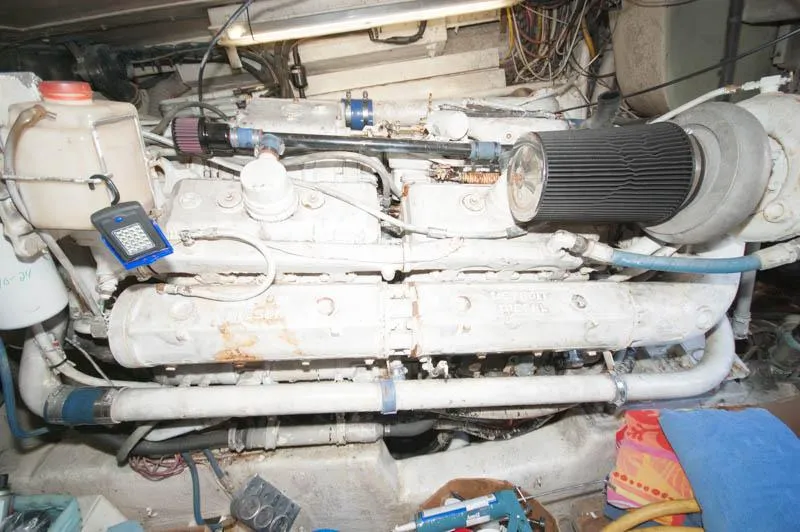 Slide: The Image of Engine room of a 1991 Ocean Yachts 58 Super Sport, showcasing mechanical components. - 29