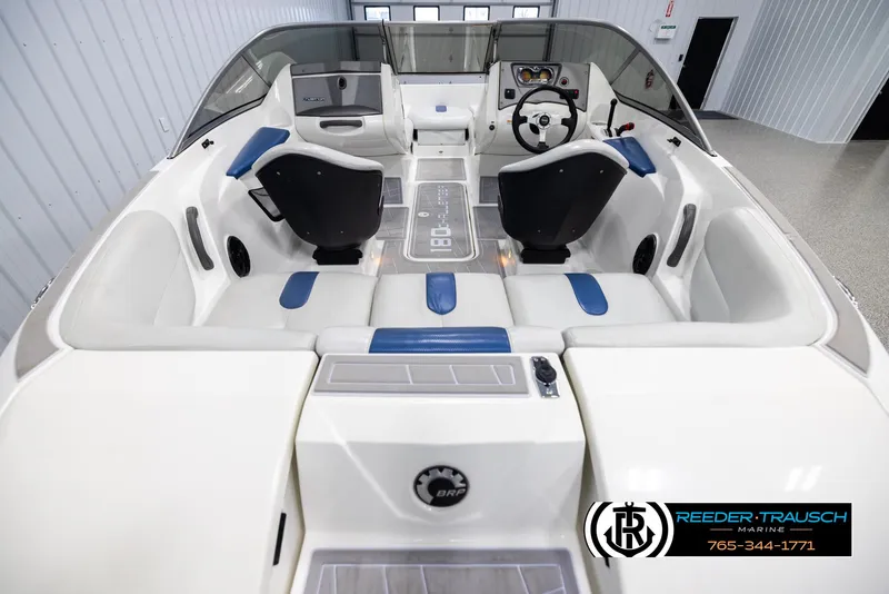 Slide: The Image of 2007 Sea-Doo 180 Challenger interior with seating and steering wheel, displayed in a showroom. - 13