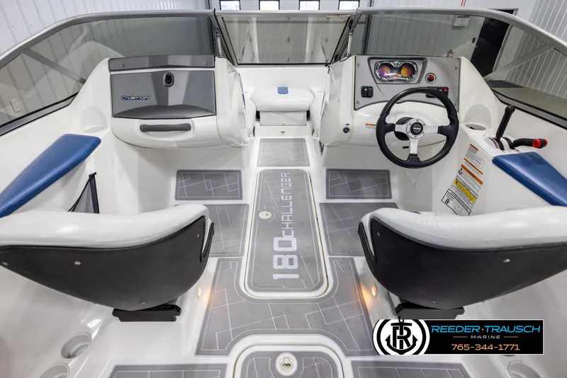Slide: The Image of 2007 Sea-Doo 180 Challenger boat interior with steering wheel and seating. - 14